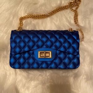 Selling blue purse.